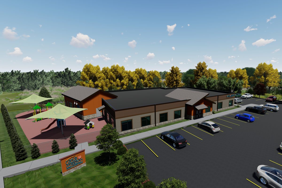Rendering of Casa de Corazon from above, showing the building, shaded play yard, and parking